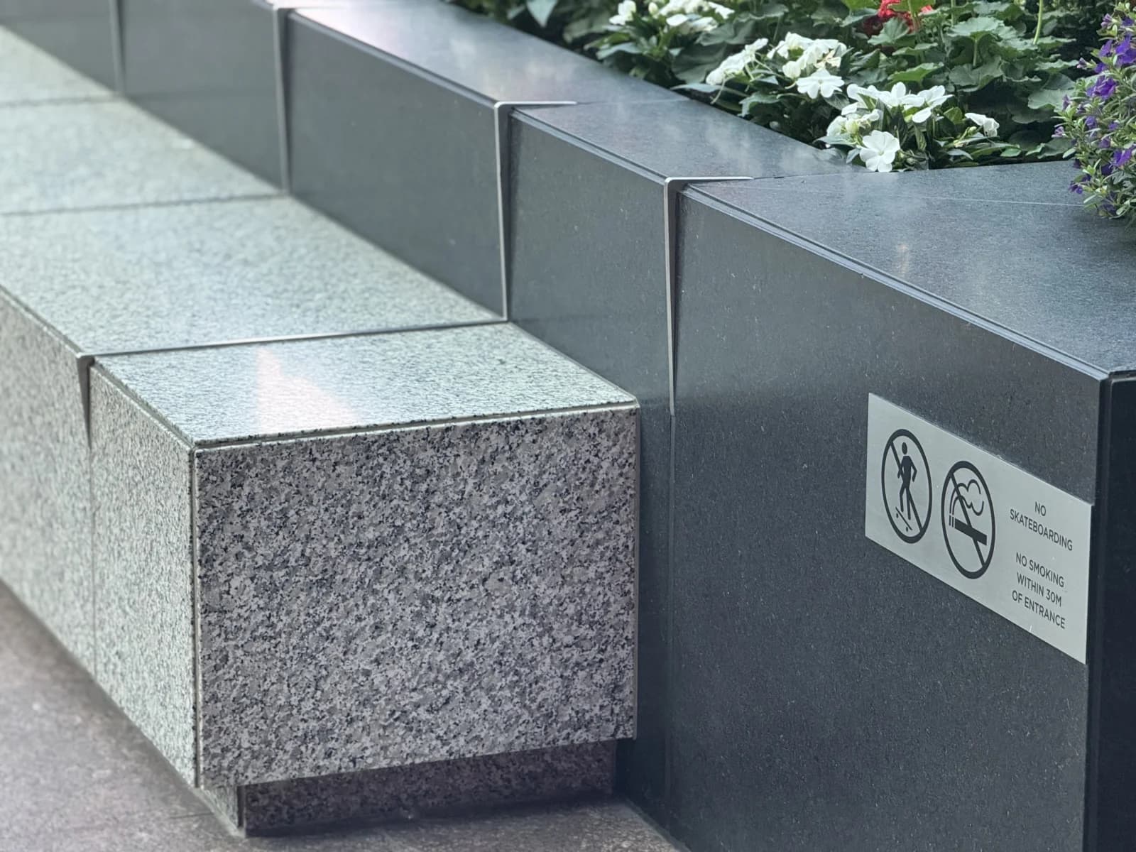 Skate Stoppers installed in a Canadian commercial setting — stainless skateboard deterrent hardware